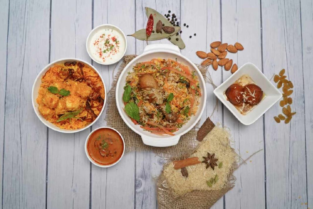 A table topped with Indian Food.