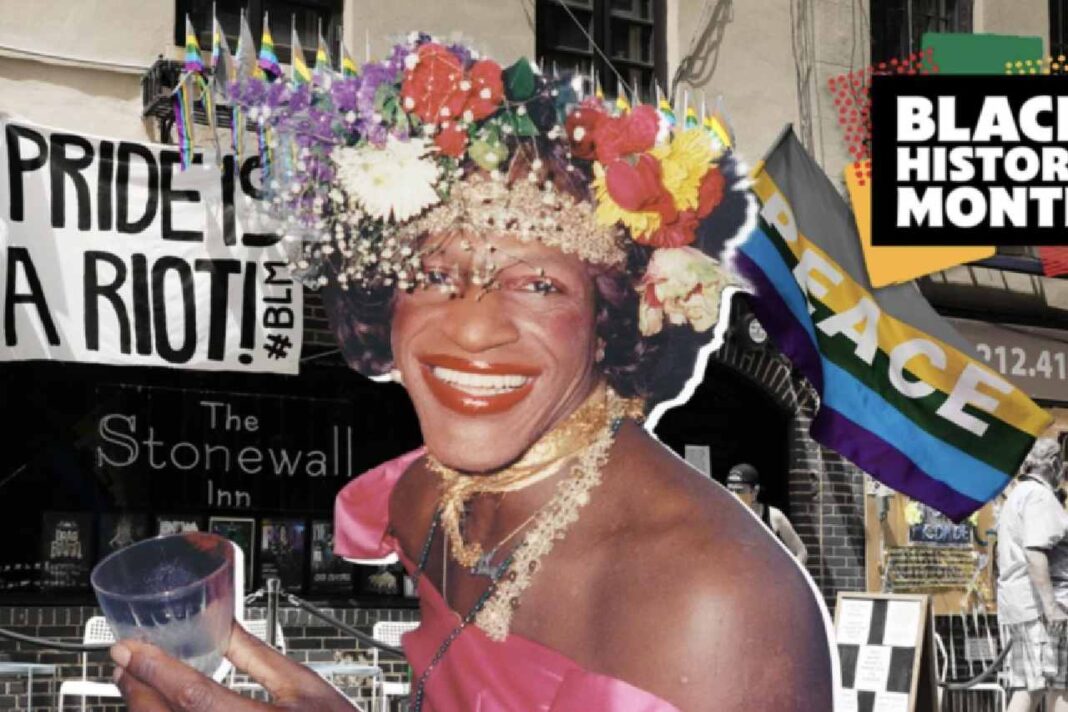 Portrait of Marsha P. Johnson smiling in front of the Stonewall Inn, wearing a flower crown and pink dress, surrounded by Pride and peace flags, and a 